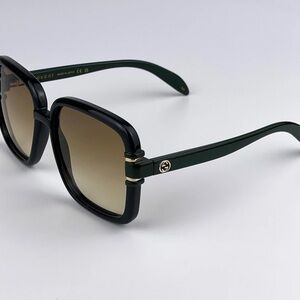 Gucci Women's Sunglasses with Black Frame and Green Arms
